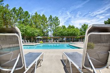 Sparkling tropical style pool with sundeck